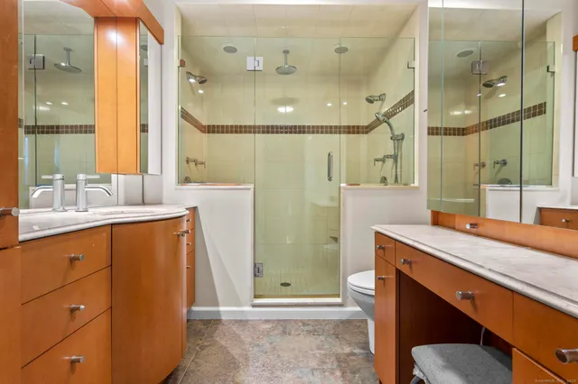 a room that has a bed and a table in it