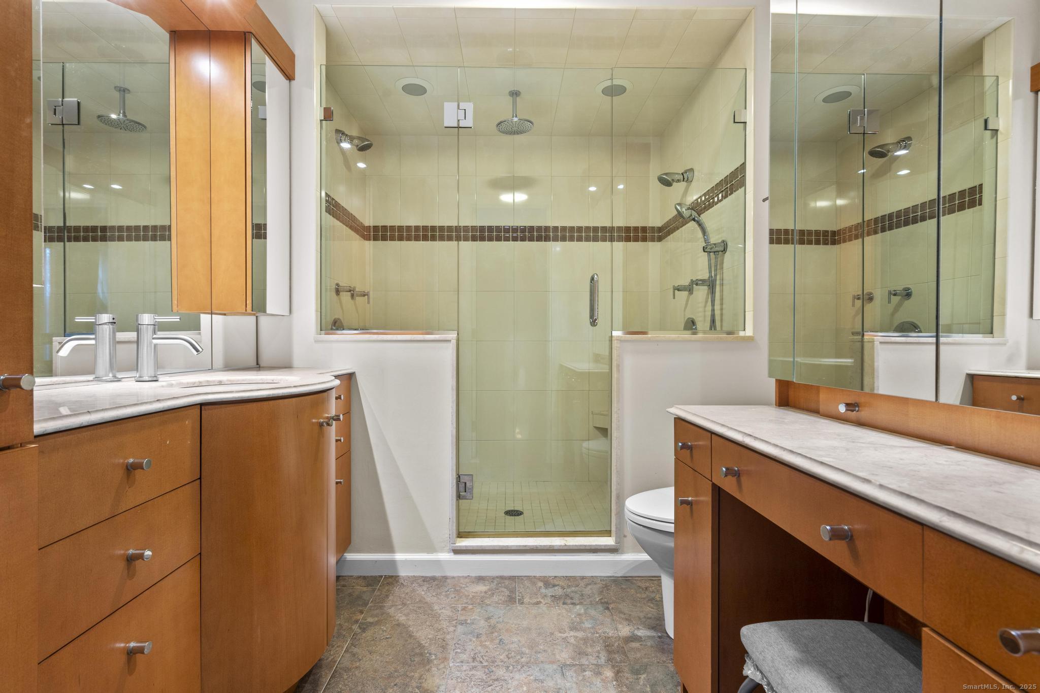 15 Derbyshire, Unit 15 Derby, CT 06418 - Photo 16 of 39 a bathroom with a sink a toilet and shower