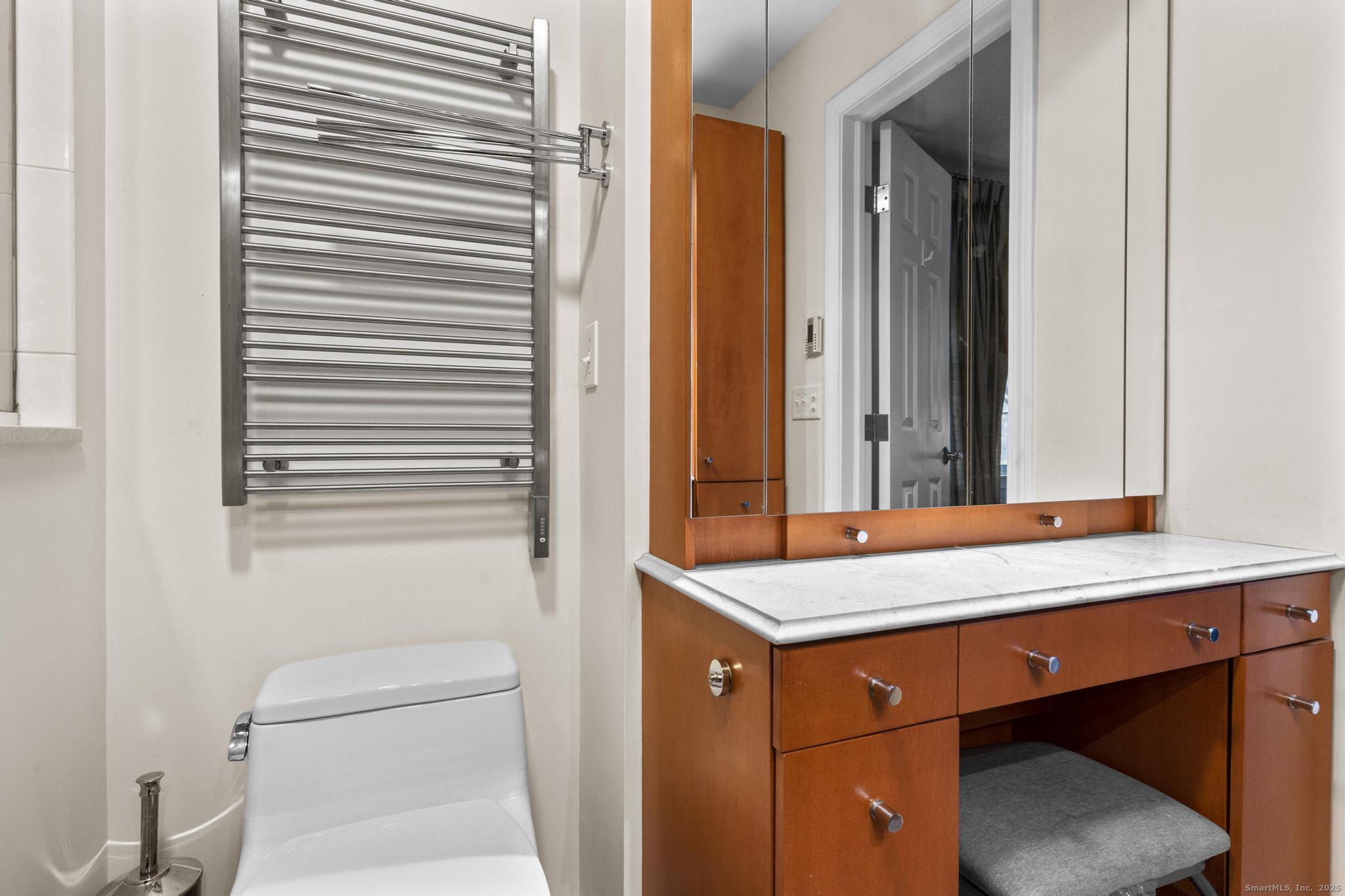 15 Derbyshire, Unit 15 Derby, CT 06418 - Photo 17 of 39 a room that has a bed and a table in it