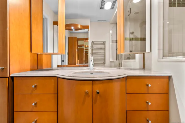 a bathroom with a mirror and a sink