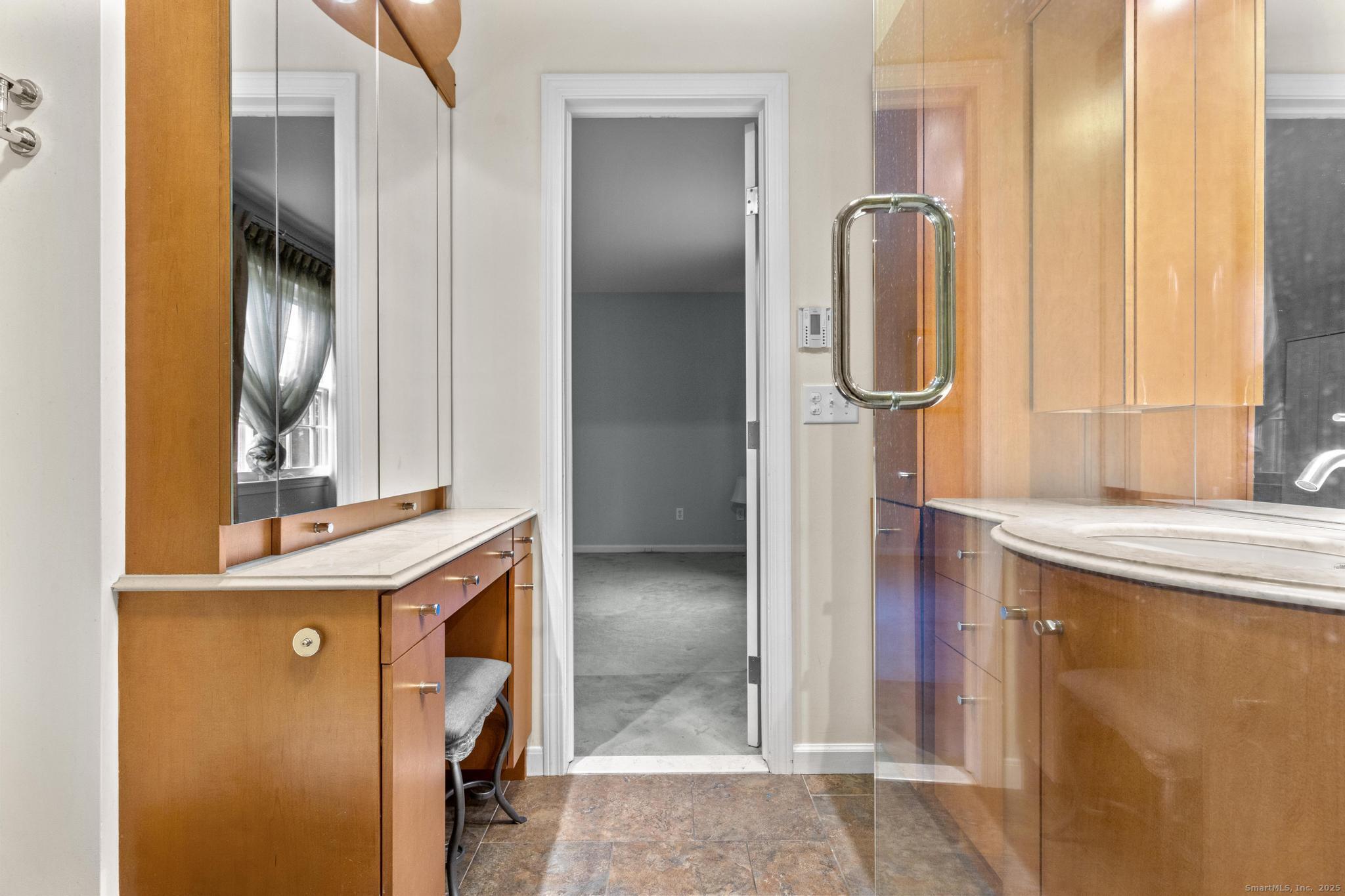 15 Derbyshire, Unit 15 Derby, CT 06418 - Photo 19 of 39 a bathroom with a mirror and a sink