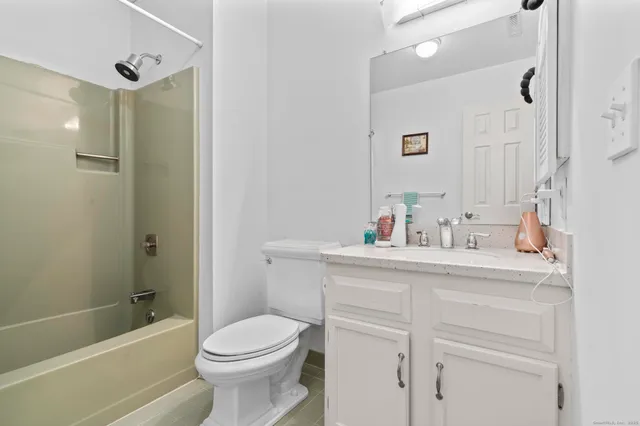 a bathroom with a shower and a glass door