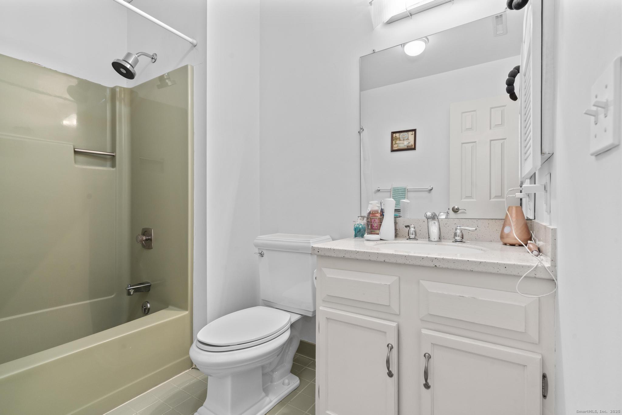 15 Derbyshire, Unit 15 Derby, CT 06418 - Photo 25 of 39 a bathroom with a sink toilet and shower