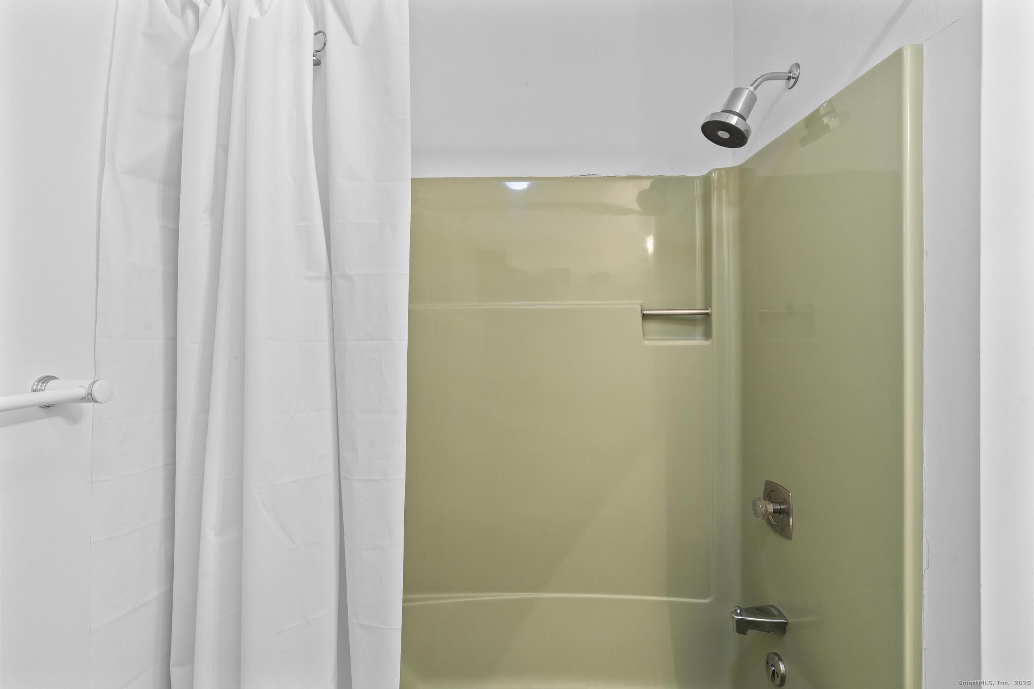 15 Derbyshire, Unit 15 Derby, CT 06418 - Photo 26 of 39 a bathroom with a shower and a glass door