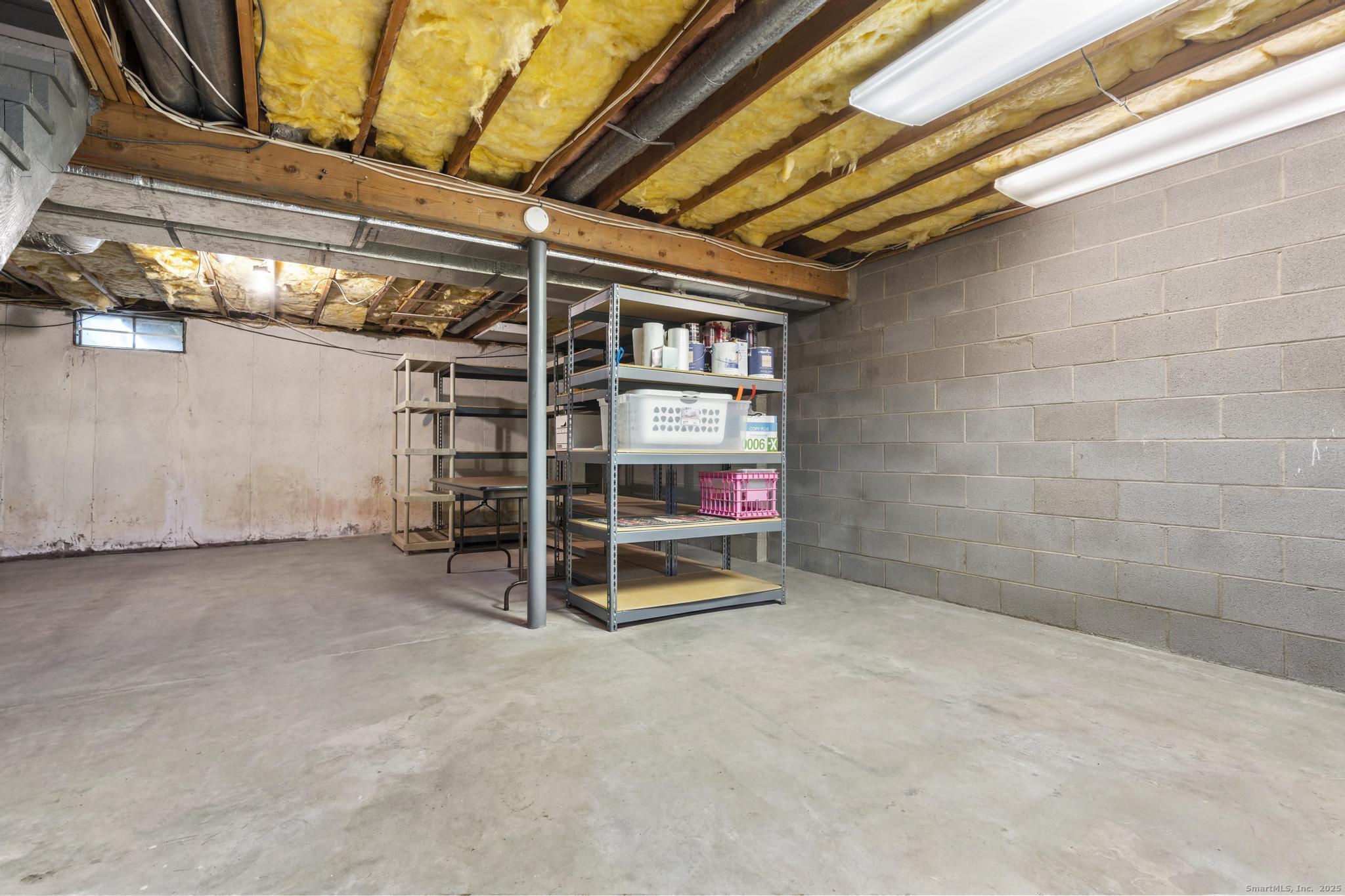 15 Derbyshire, Unit 15 Derby, CT 06418 - Photo 27 of 39 a view of an empty room with a staircase