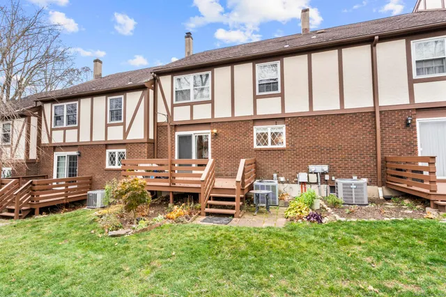 a view of a house with backyard porch and sitting area