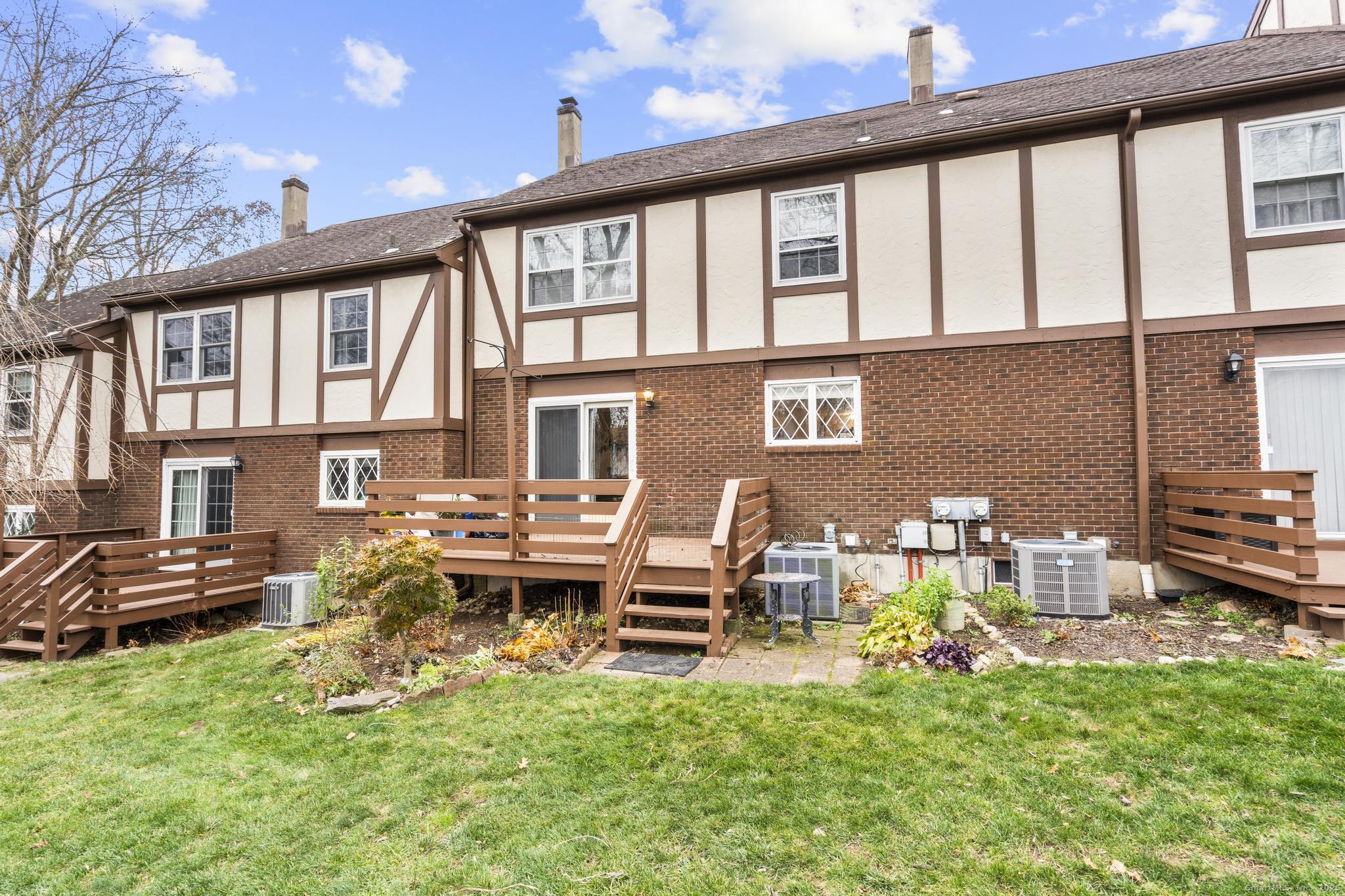 15 Derbyshire, Unit 15 Derby, CT 06418 - Photo 30 of 39 a front view of a house with outdoor seating