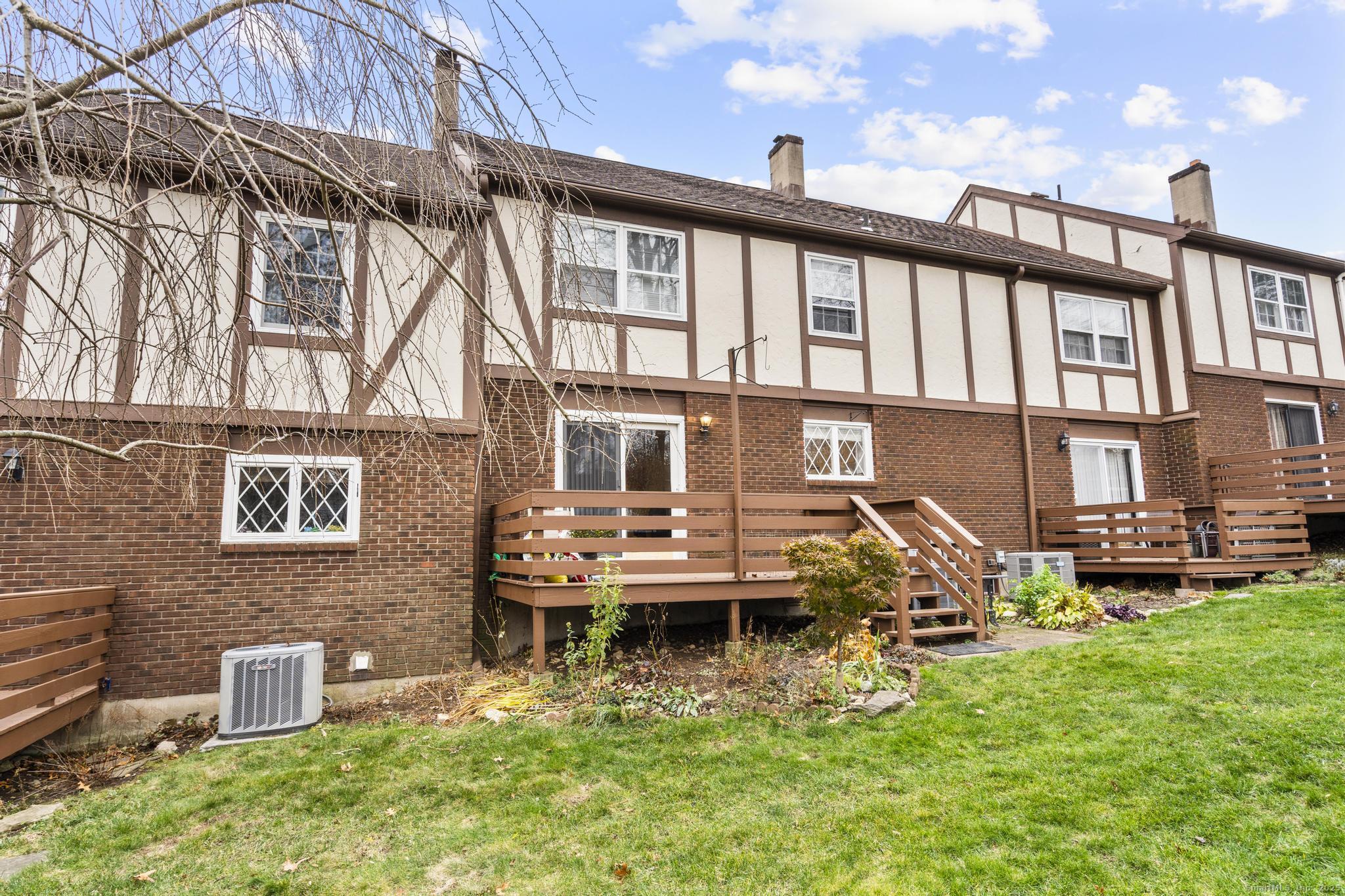 15 Derbyshire, Unit 15 Derby, CT 06418 - Photo 31 of 39 a view of a house with backyard porch and sitting area