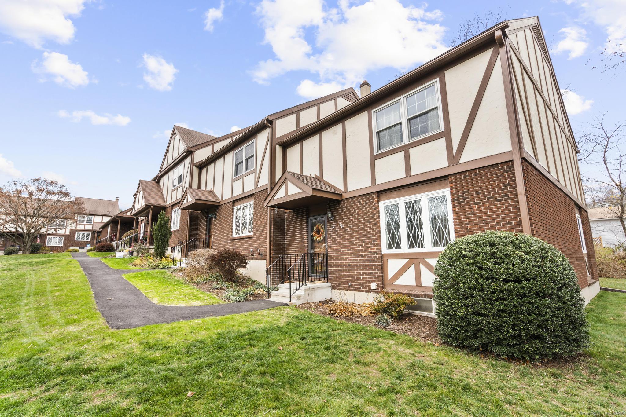 15 Derbyshire, Unit 15 Derby, CT 06418 - Photo 35 of 39 a front view of a house with a yard