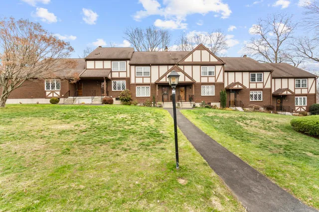 an aerial view of a house with swimming pool and outdoor space