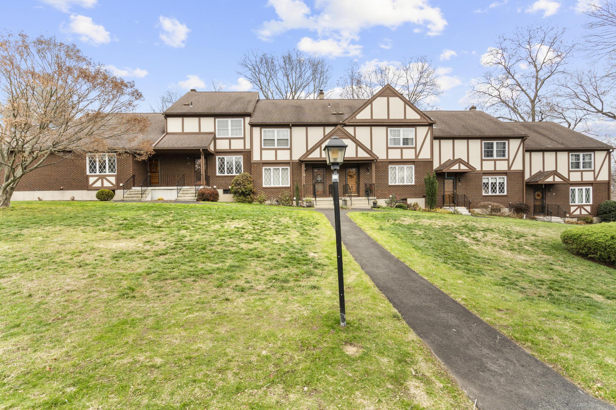 15 Derbyshire, Unit 15 Derby, CT 06418 - Photo 36 of 39 a view of a big house with a big yard and large tree