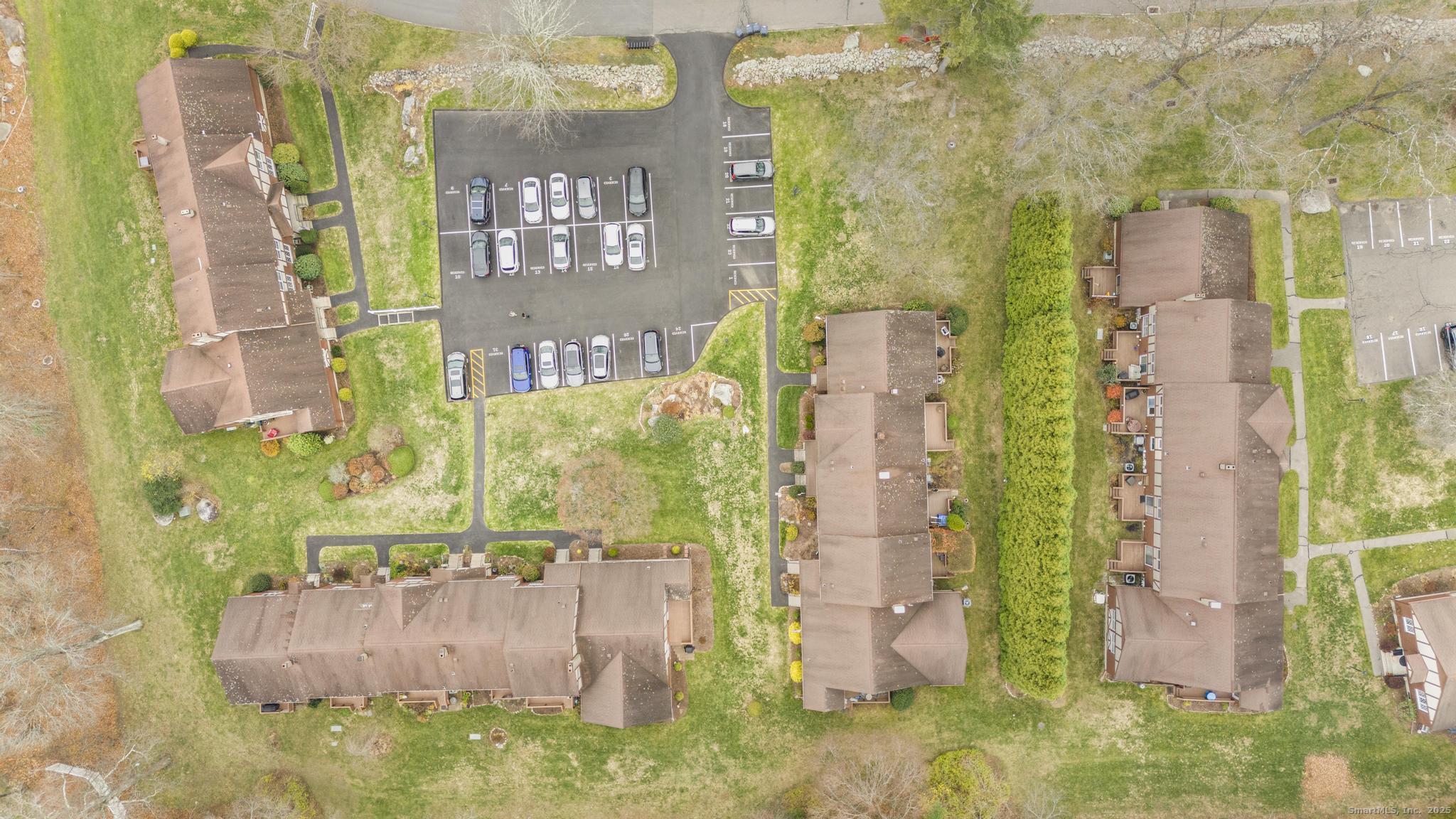 15 Derbyshire, Unit 15 Derby, CT 06418 - Photo 38 of 39 a aerial view of a residential apartment building with a yard
