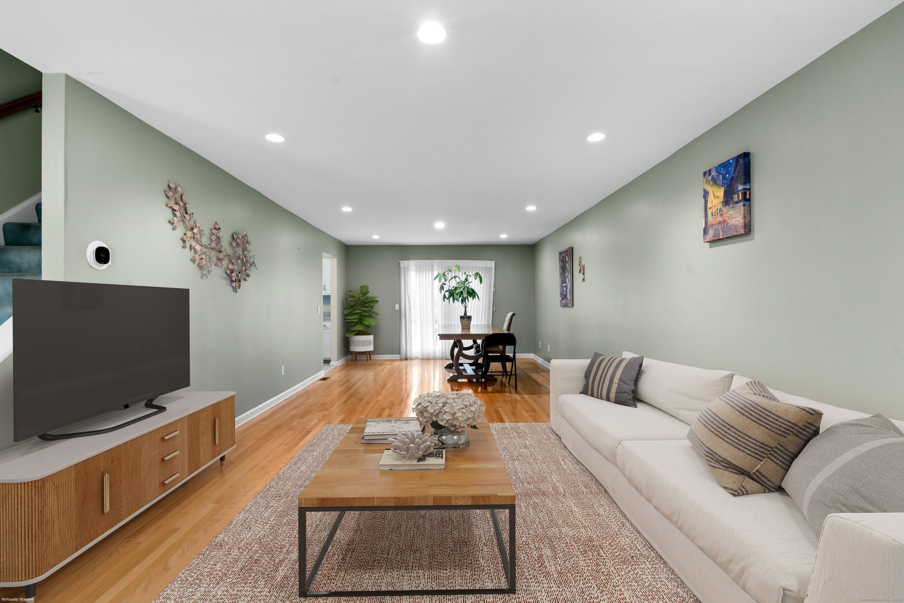 15 Derbyshire, Unit 15 Derby, CT 06418 - Photo 4 of 39 a living room with furniture and a flat screen tv