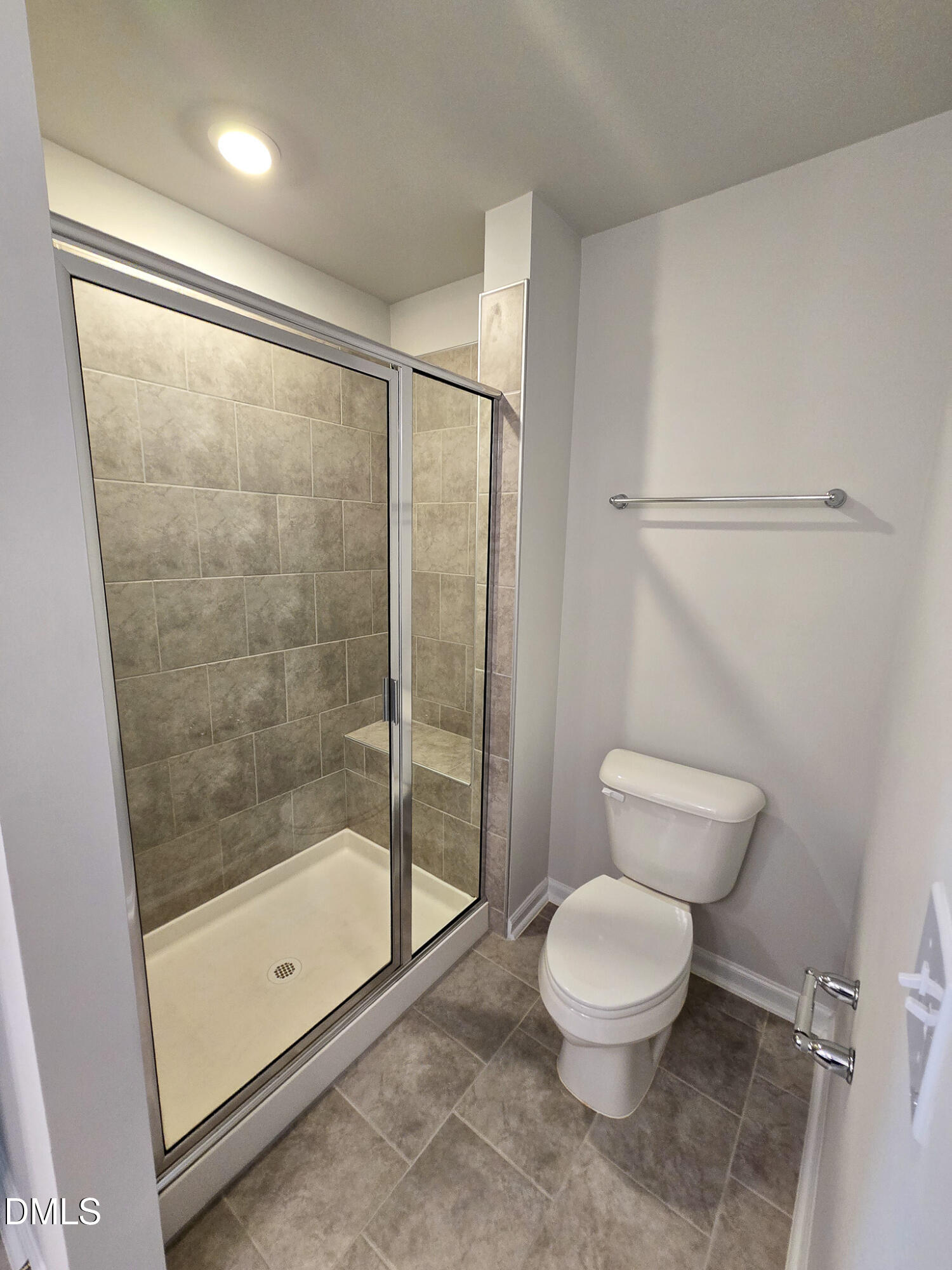 2431 Kasota Lane Raleigh, NC 27610 - Photo 32 of 46 a bathroom with a toilet and a shower
