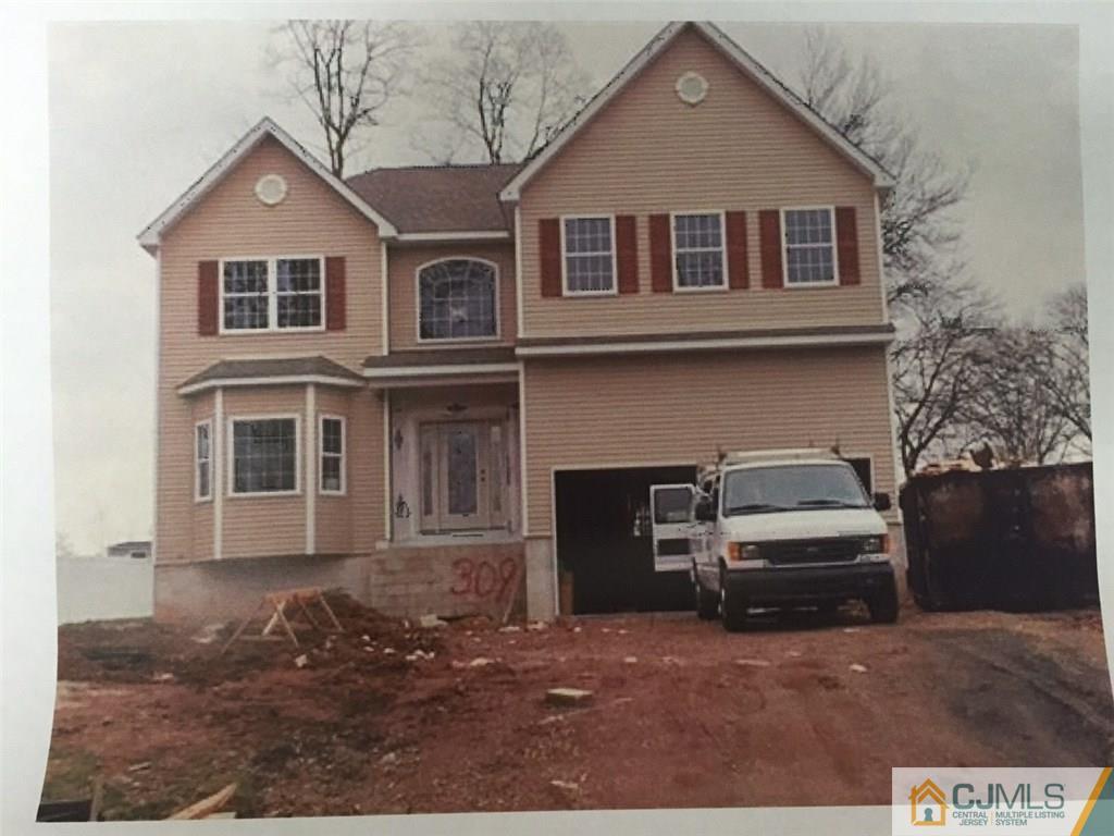 309 Chain O' Hills Road Colonia, NJ 07067 - Photo 1 of 1 a front view of a house with parking space