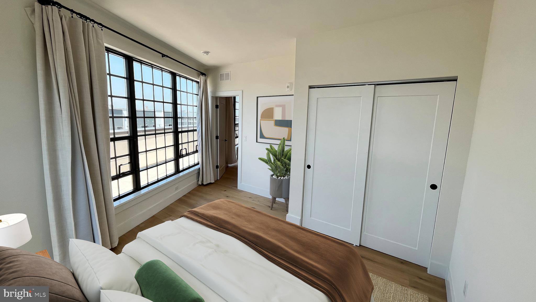 1701-15 North 2nd Street, Unit 606 Philadelphia, PA 19122 - Photo 11 of 47 a view of a bedroom with furniture and window