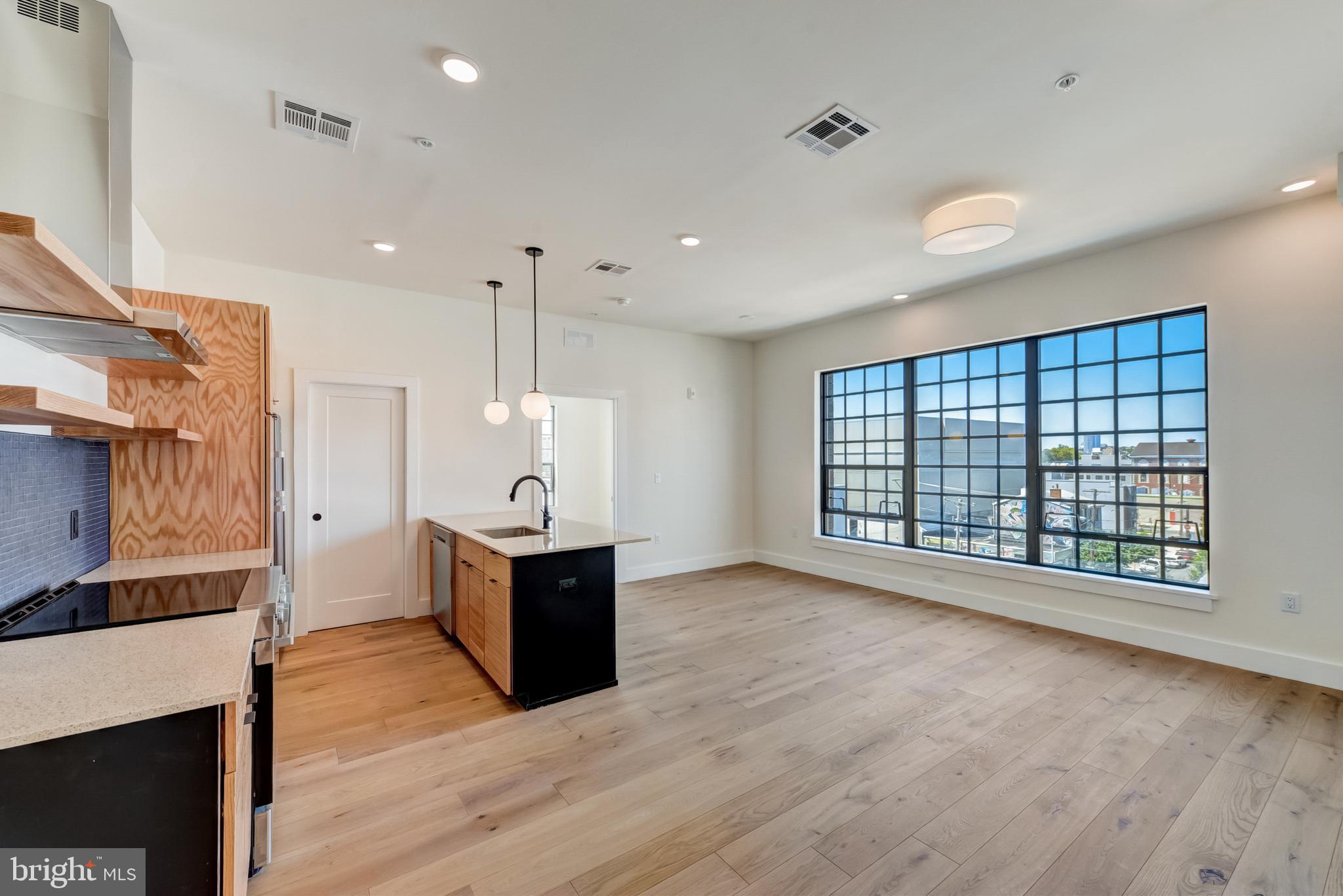 1701-15 North 2nd Street, Unit 606 Philadelphia, PA 19122 - Photo 37 of 47 a view of an empty room with wooden floor and a window