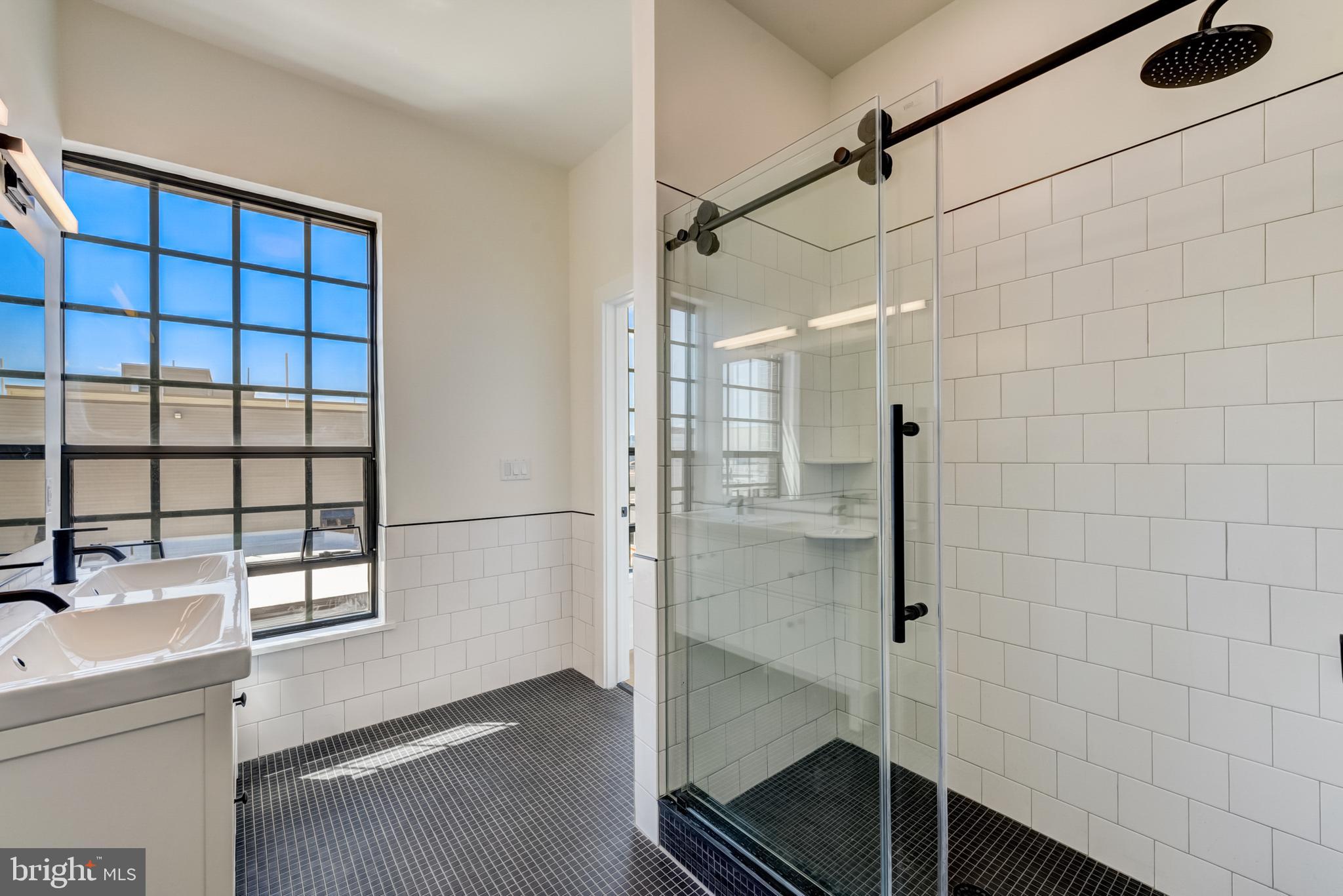 1701-15 North 2nd Street, Unit 606 Philadelphia, PA 19122 - Photo 43 of 47 a bathroom with a sink and a shower