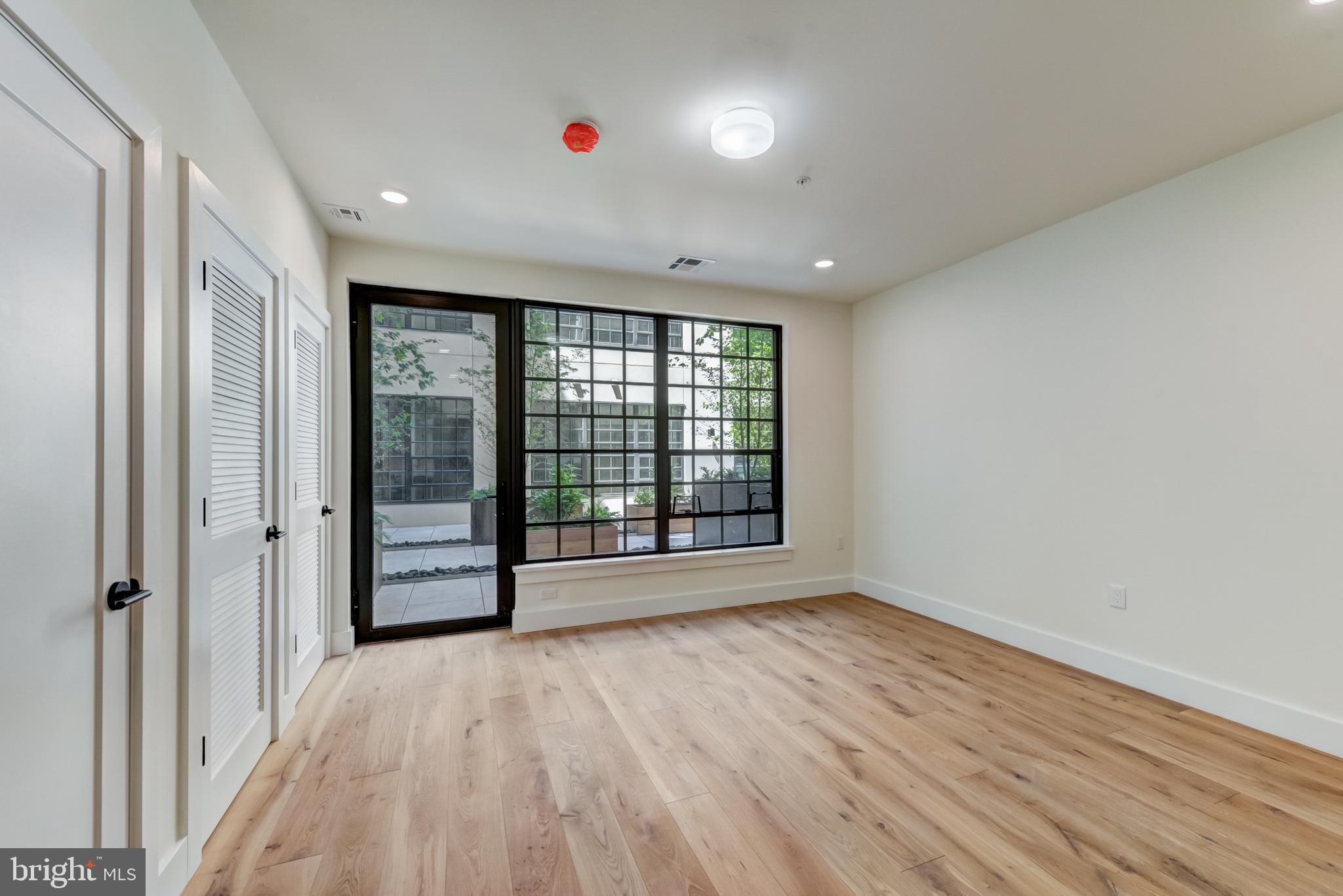 1701-15 North 2nd Street, Unit 606 Philadelphia, PA 19122 - Photo 47 of 47 a view of an empty room with wooden floor and a window