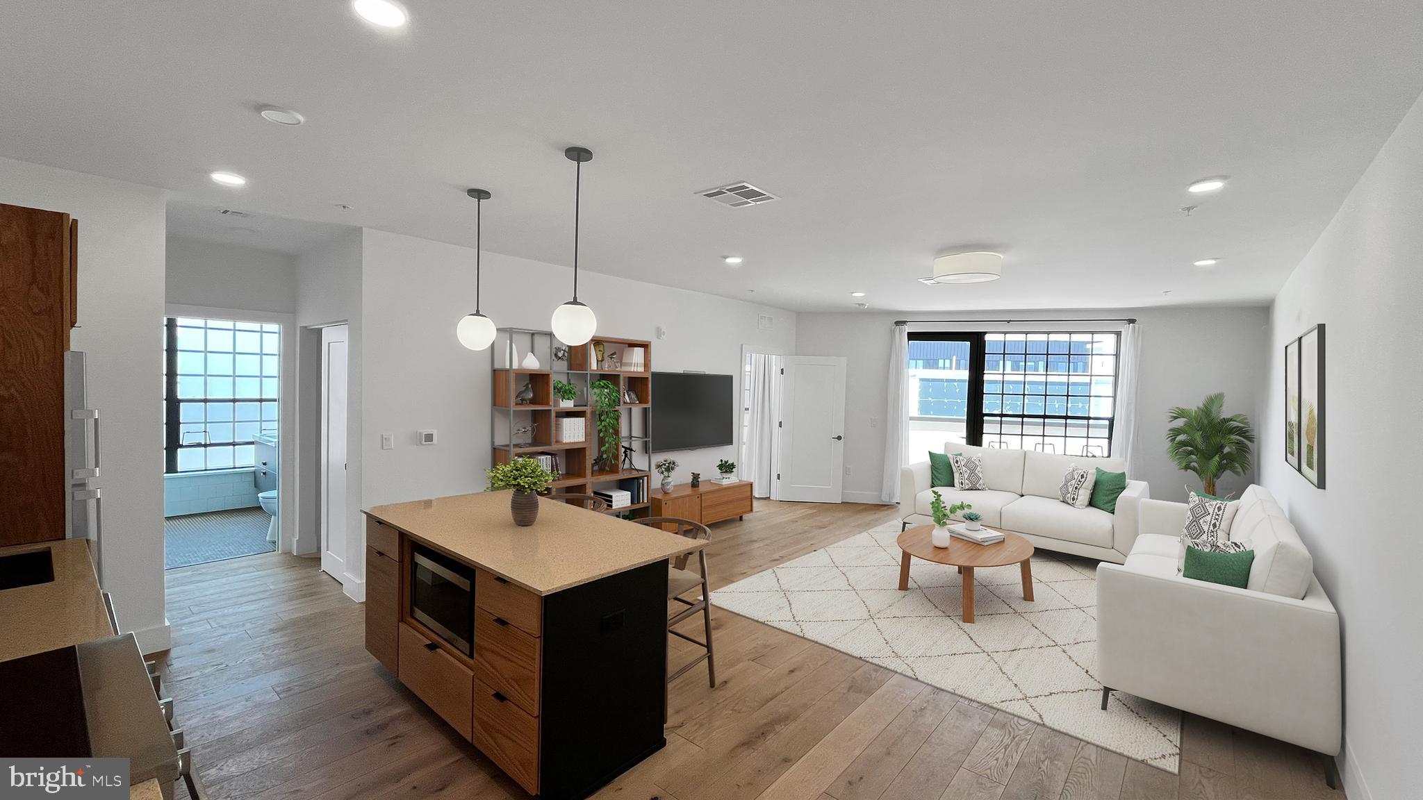 1701-15 North 2nd Street, Unit 606 Philadelphia, PA 19122 - Photo 6 of 47 a living room with furniture and wooden floor