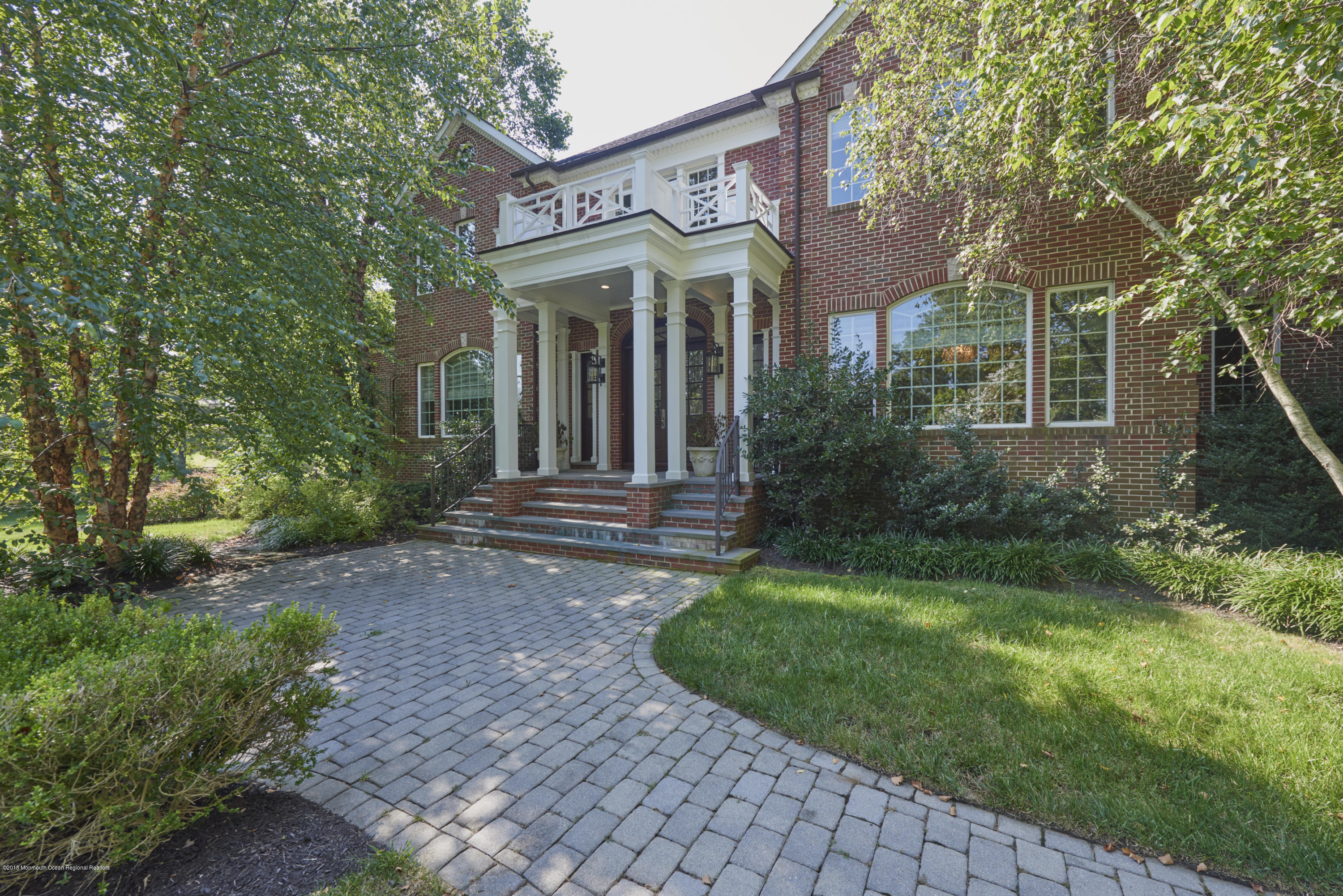 6 Willowbrook Road Rumson, NJ 07760 - Photo 1 of 33 front view of a house with a yard