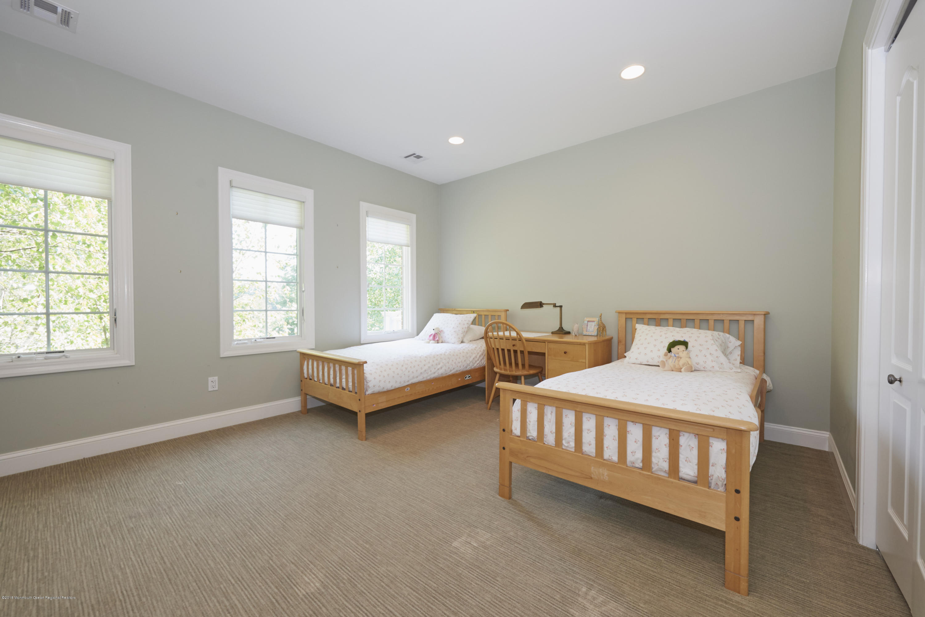 6 Willowbrook Road Rumson, NJ 07760 - Photo 25 of 33 a bedroom with a bed and a window