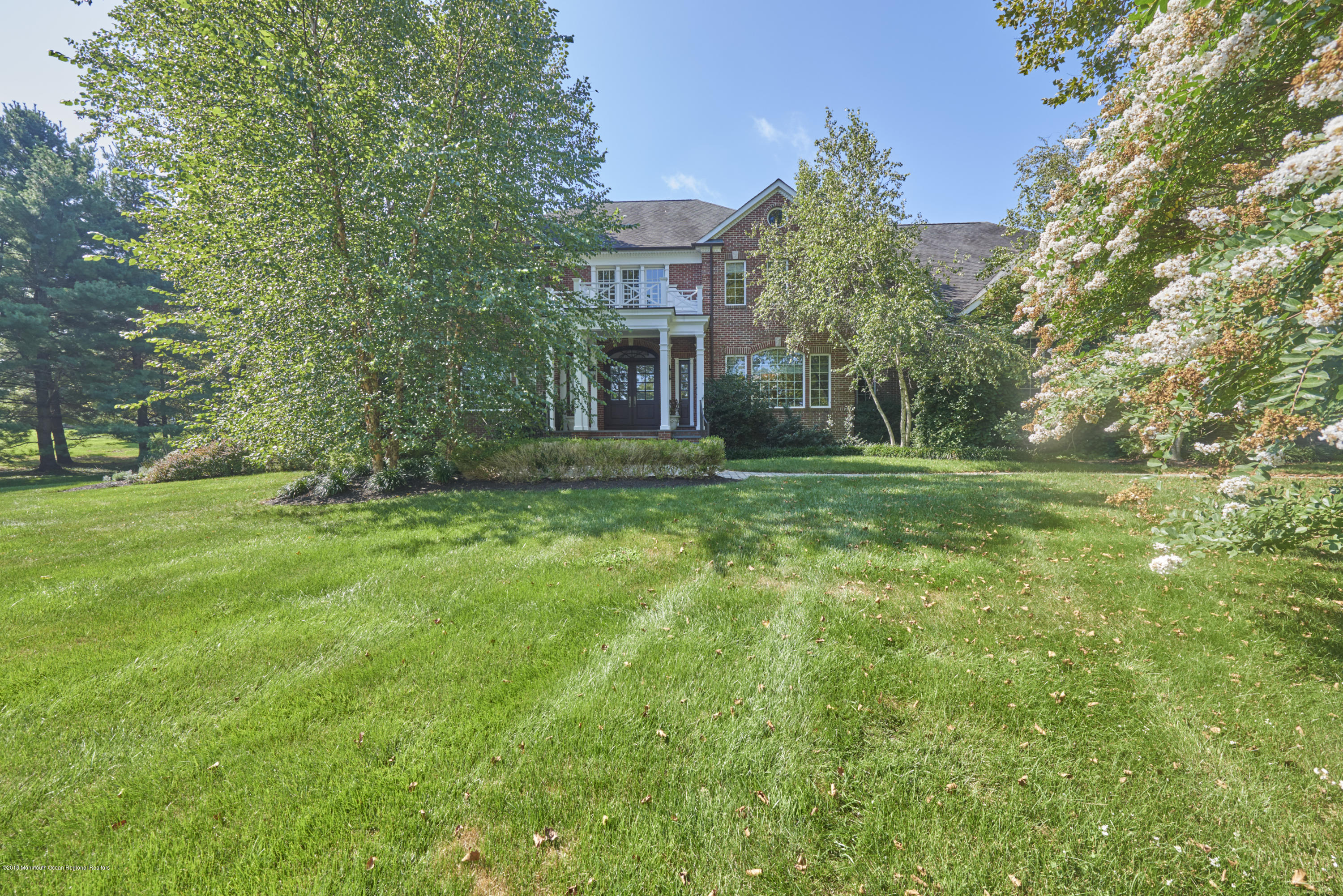 6 Willowbrook Road Rumson, NJ 07760 - Photo 3 of 33 a view of a big yard next to a house