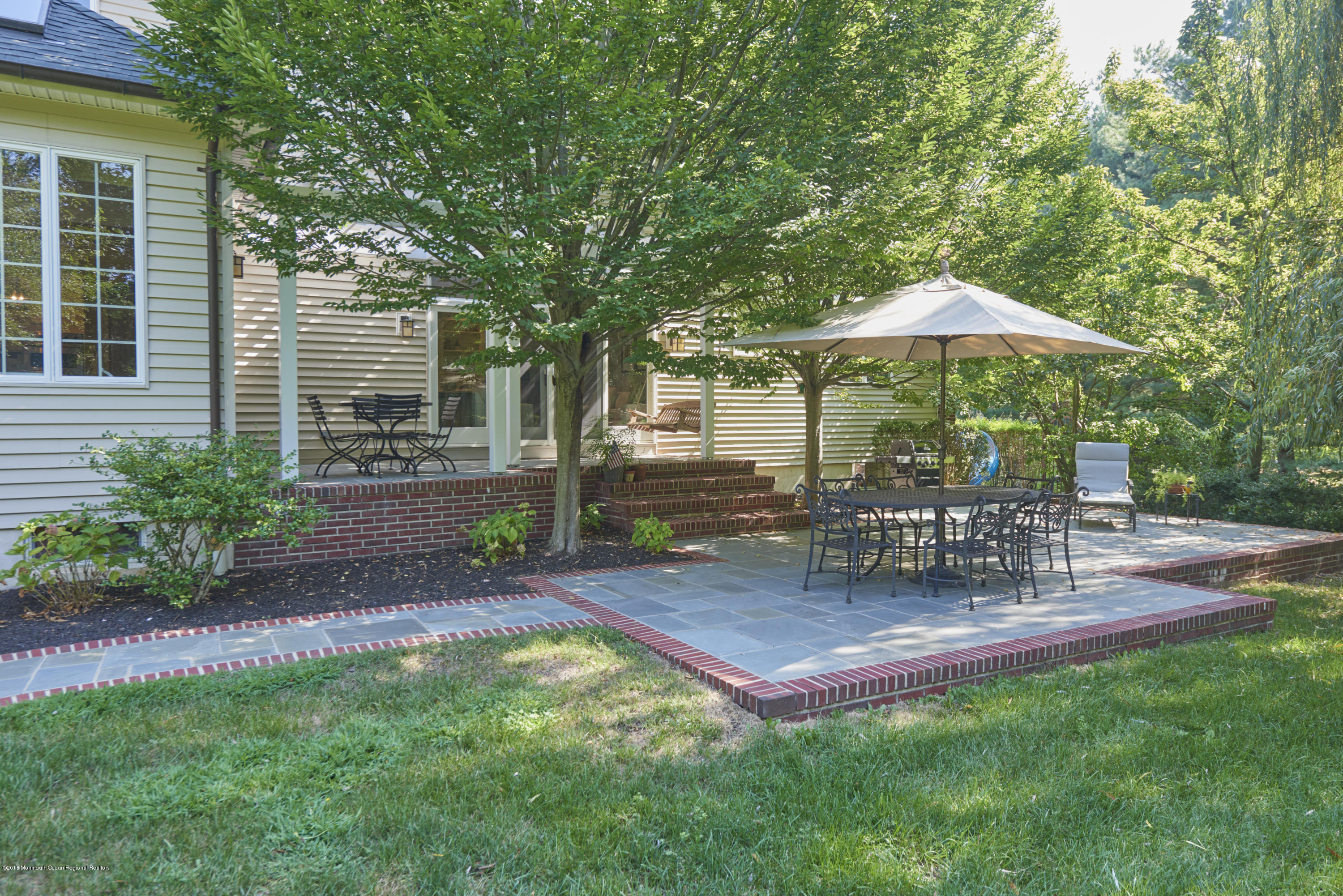 6 Willowbrook Road Rumson, NJ 07760 - Photo 31 of 33 a view of a backyard with a patio and outdoor seating