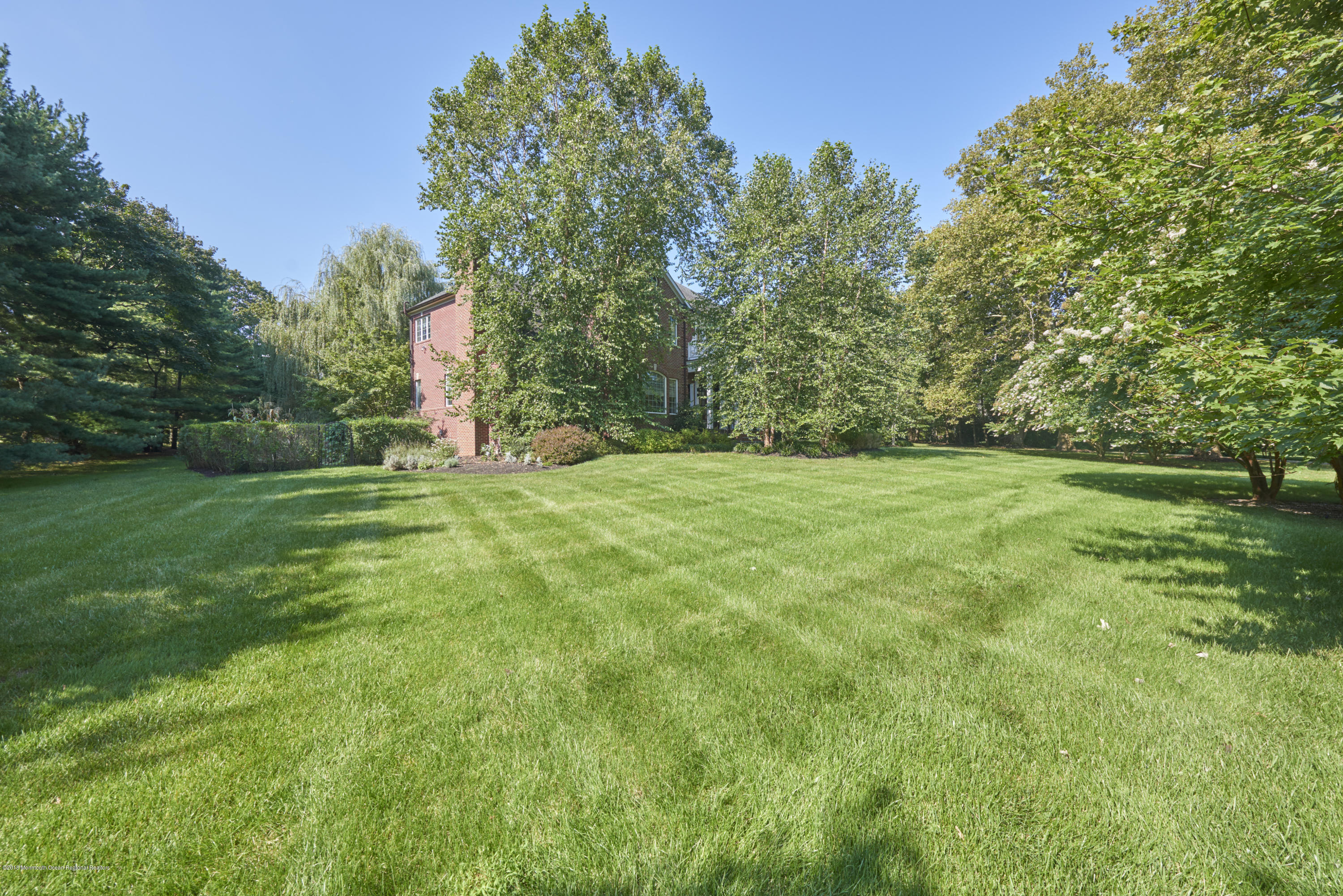 6 Willowbrook Road Rumson, NJ 07760 - Photo 33 of 33 a view of a grassy field with trees in the background