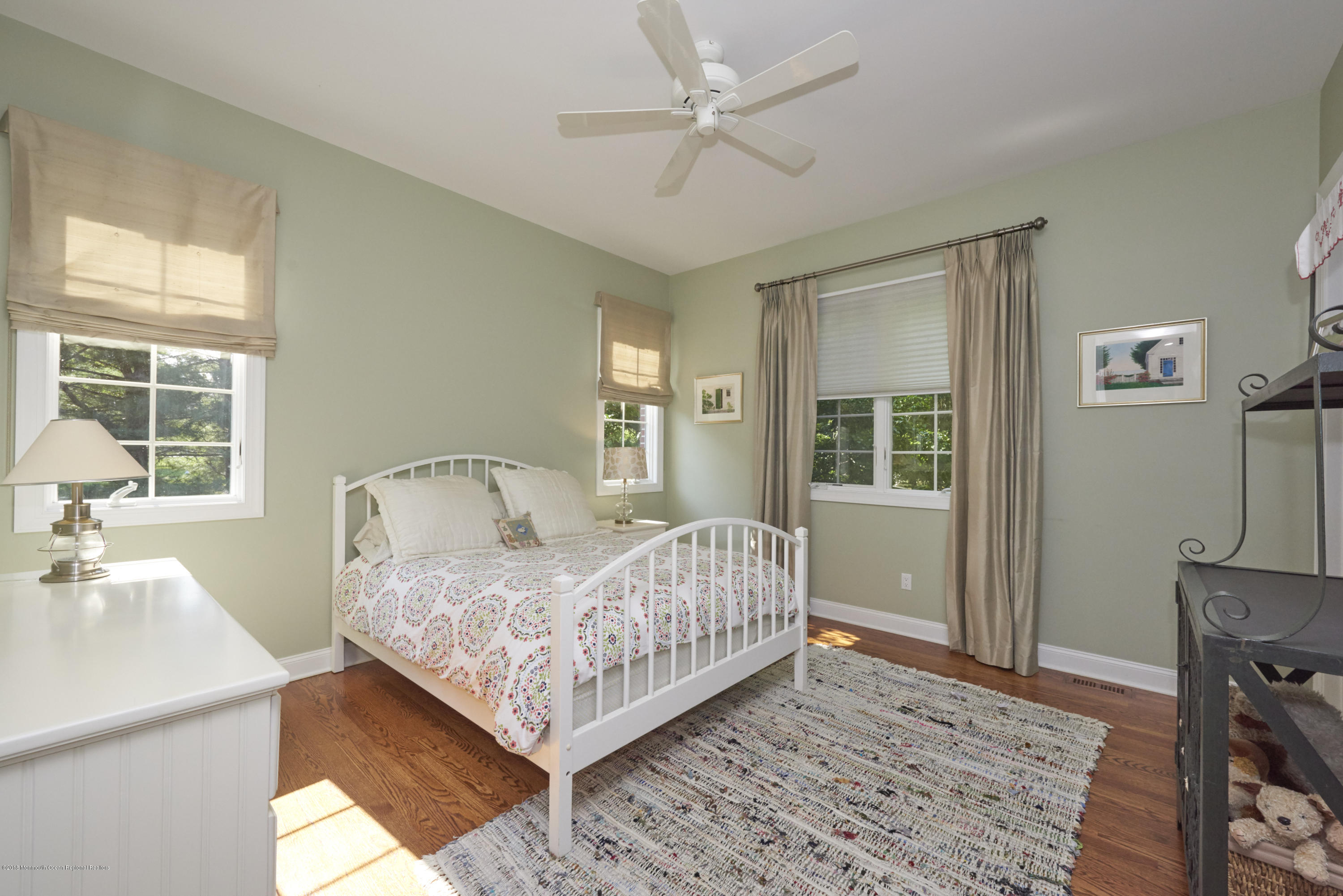 6 Willowbrook Road Rumson, NJ 07760 - Photo 9 of 33 a bedroom with a bed and window