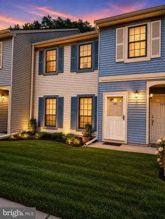a backyard of a house with yard and barbeque oven