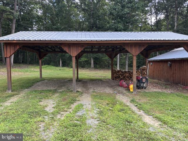 730 Grizzly Road Mathias, WV 26812 - Photo 32 of 45 Rustic shelter amidst serene woods.