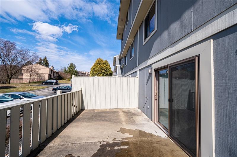 2531 Hunting Ridge Trail Bridgeville, PA 15017 - Photo 12 of 24 Fenced in spacious back patio perfect for grilling and entertaining guests outside. Newer patio door leads to the large lower level gameroom.