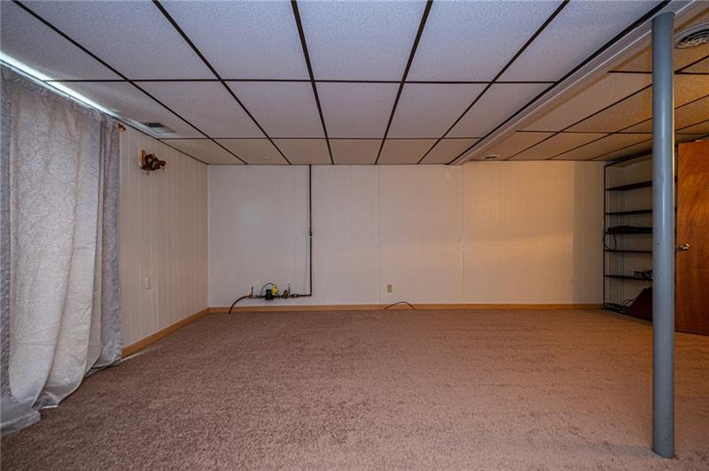 2531 Hunting Ridge Trail Bridgeville, PA 15017 - Photo 19 of 24 Lower level gameroom has built in shelving & plenty of space for all of your media equipment.