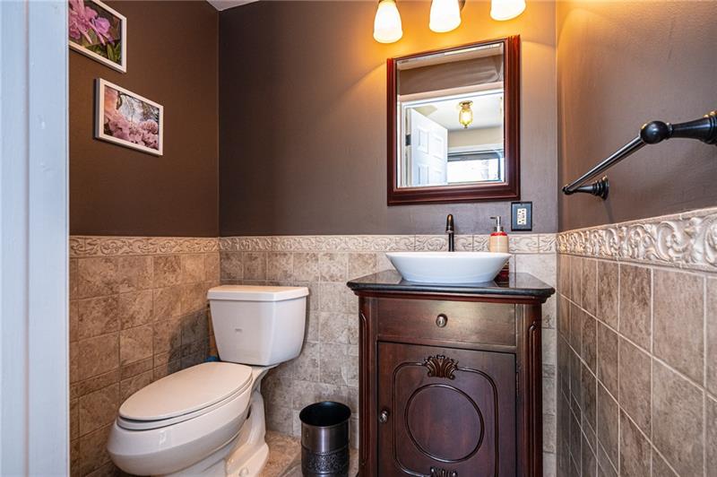 2531 Hunting Ridge Trail Bridgeville, PA 15017 - Photo 5 of 24 First floor powder room has been nicely updated with a vessel style sink/vanity, new fixtures and ceramic tile.