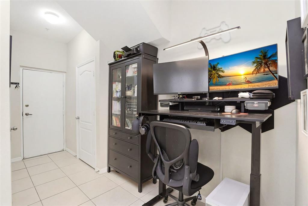 6458 South Goldenrod Road, Unit 29B Orlando, FL 32822 - Photo 17 of 40 a room with furniture and flat screen tv