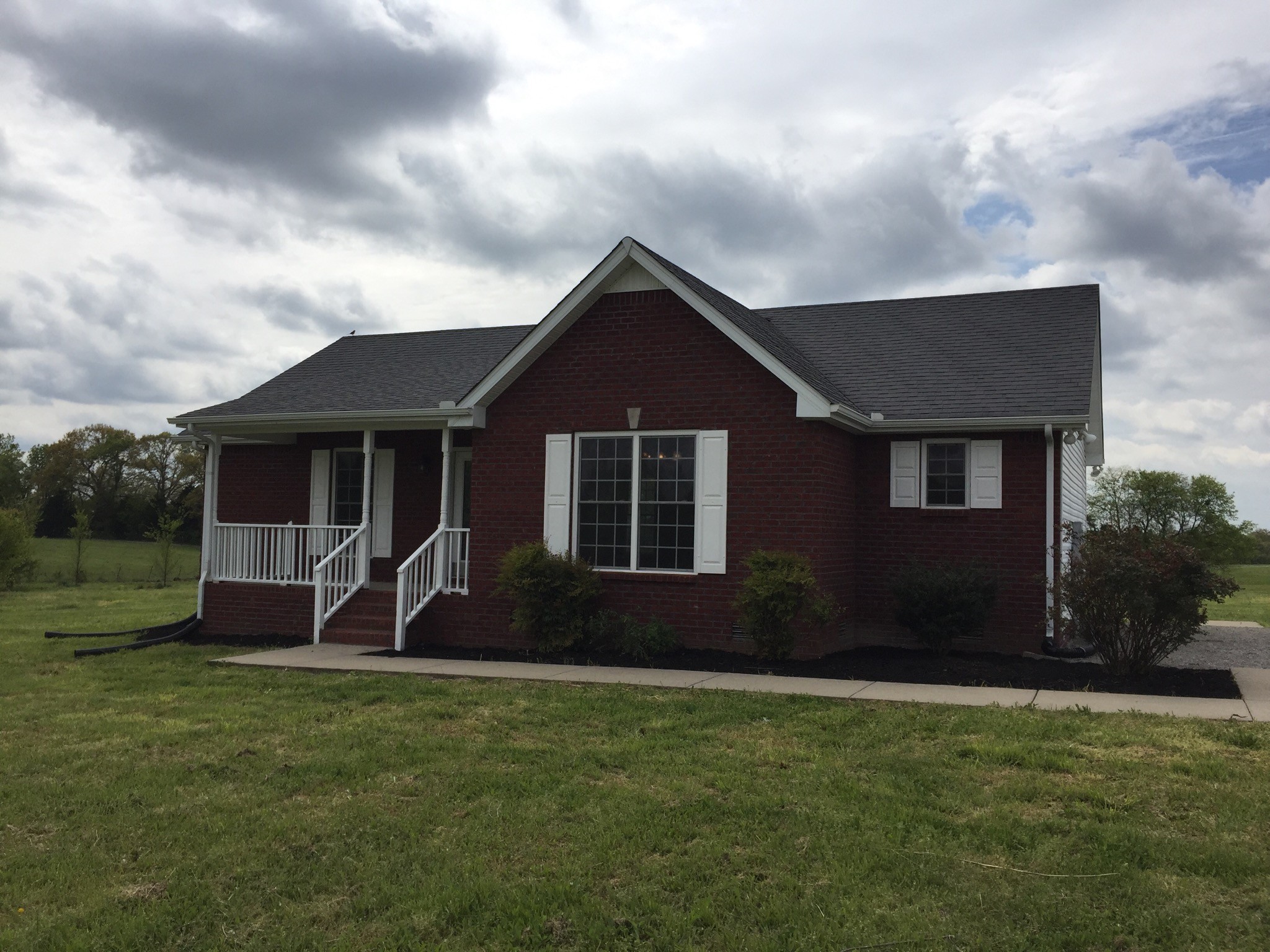 5722 Bill Anderson Road Portland, TN 37148 - Photo 2 of 11 a front view of a house with garden
