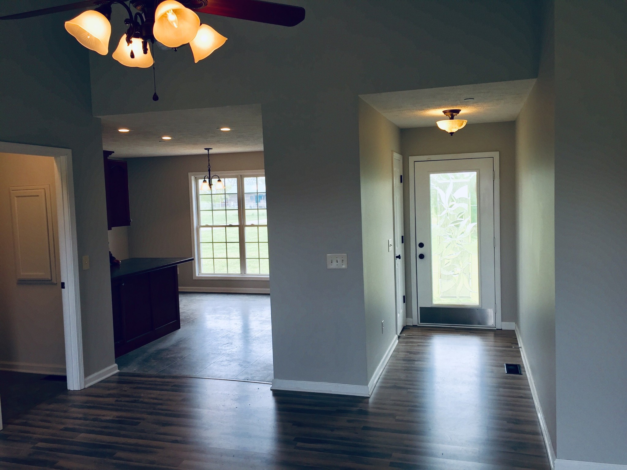 5722 Bill Anderson Road Portland, TN 37148 - Photo 5 of 11 an empty room with wooden floor and windows