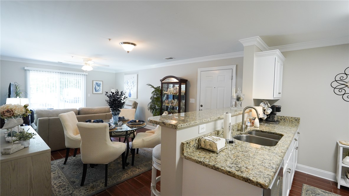 303 Lookover Drive Anderson, SC 29621 - Photo 14 of 46 This open concept living area seamlessly connects the kitchen and dining spaces.