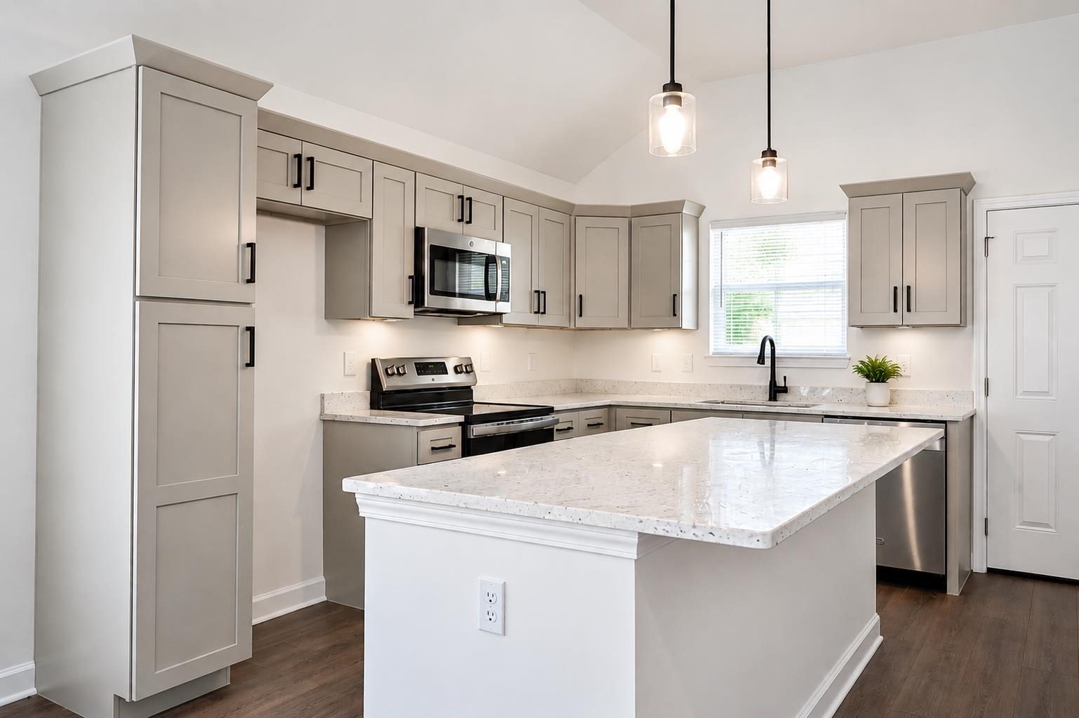 1687 East Alcy Road Memphis, TN 38114 - Photo 2 of 7 Kitchen featuring light gray cabinetry, stainless steel appliances, granite countertops, and wood-finish flooring