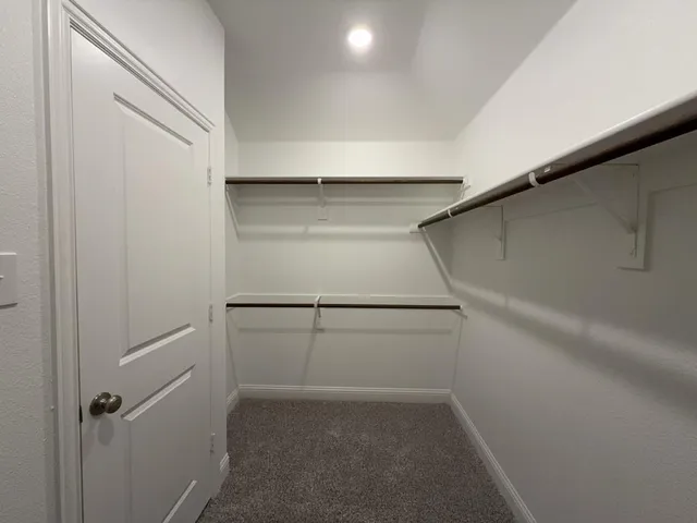 a view of an empty walk in closet