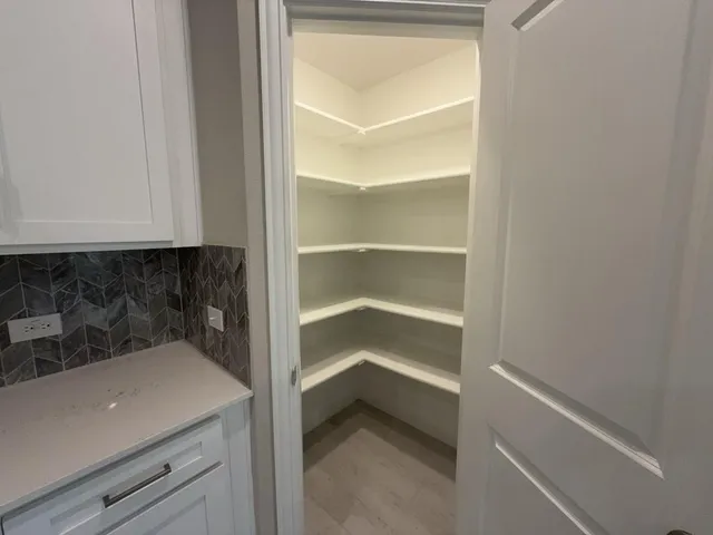 a view of a closet in the kitchen