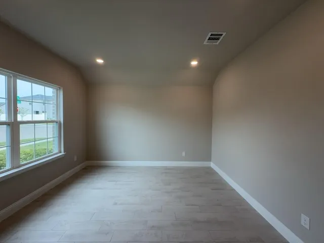 a view of an empty room with a window
