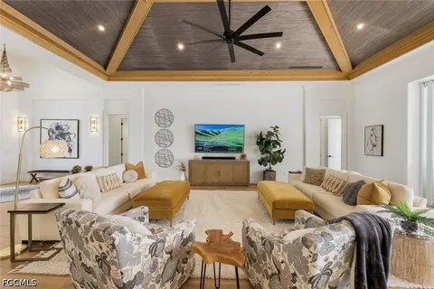 a kitchen with stainless steel appliances white cabinets and a stove top oven