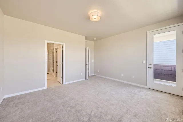 an empty room with closet area