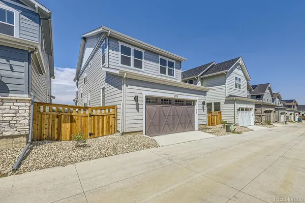 a front view of a house with a outdoor space