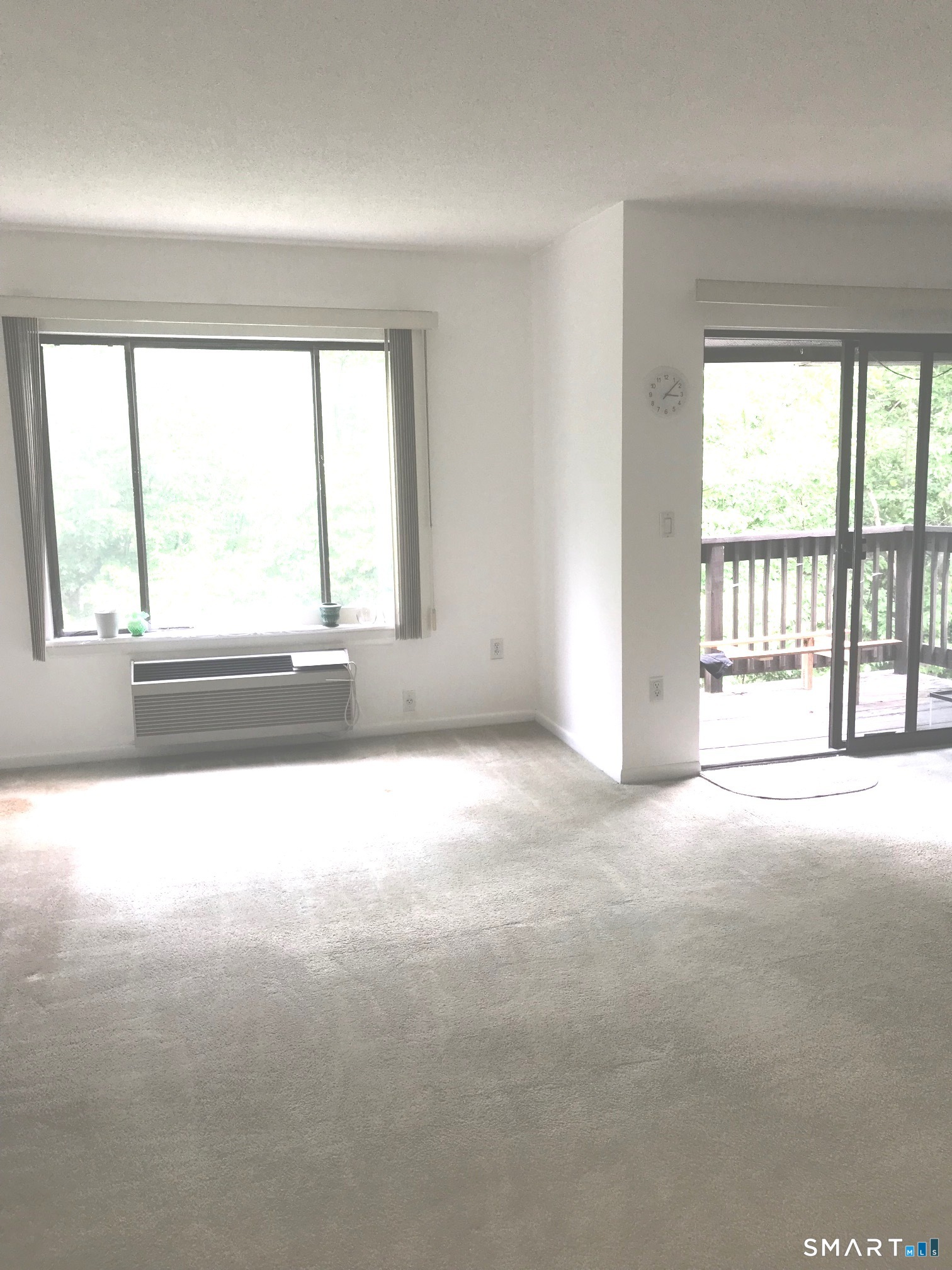 175 Mill Pond Road, Unit 346 Hamden, CT 06514 - Photo 5 of 18 a view of an empty room with a window