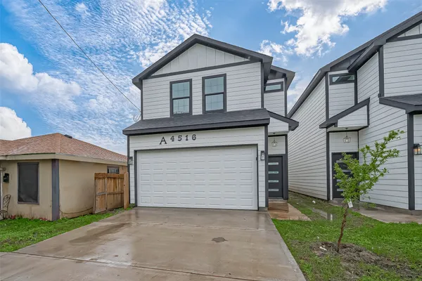 a front view of a house with a garage