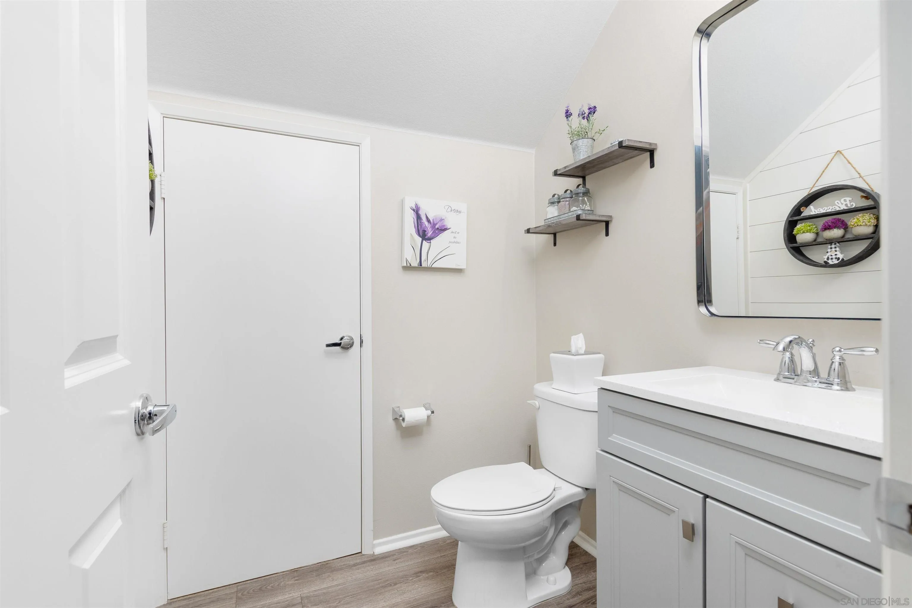 216 Oberlander Way Fallbrook, CA 92028 - Photo 12 of 31 a bathroom with a sink a toilet and a mirror