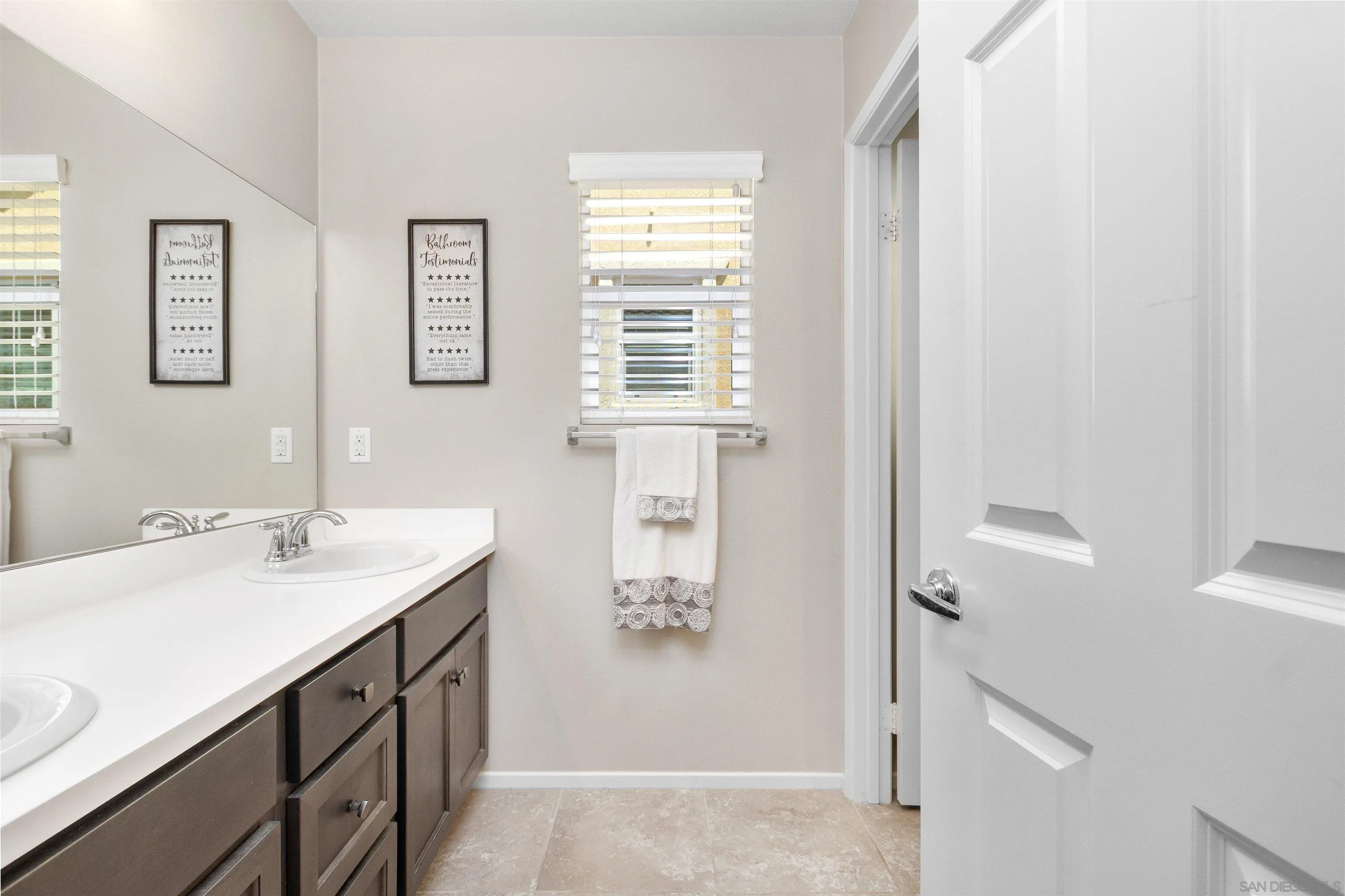 216 Oberlander Way Fallbrook, CA 92028 - Photo 17 of 31 a bathroom with a sink and a mirror